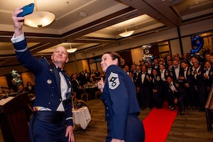 Commander and command chief take a selfie with newly promoted chiefs
