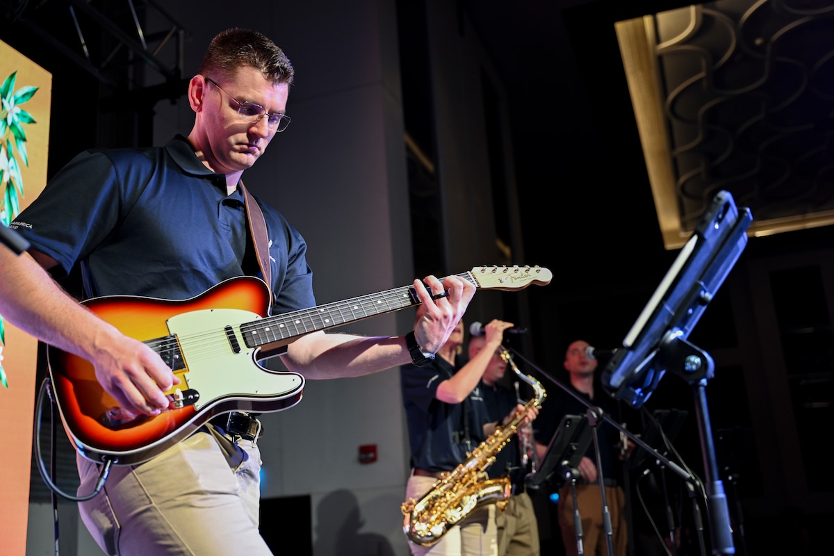U.S. Air Force Senior Airman Tomas Antonic, guitarist with the U.S. Air Forces in Europe and Air Forces Africa Band’s “Touch N’ Go” ensemble, performs during a VIP reception in Adana, Türkiye, April 4, 2025. The event was part of a weeklong tour supporting the city’s annual Orange Blossom Carnaval, aimed at strengthening U.S.-Türkiye ties through cultural diplomacy. Hosted by the U.S. State Department, the reception welcomed international diplomats, local officials, and community leaders. (U.S. Air Force photo by Master Sgt. Siuta Ika)