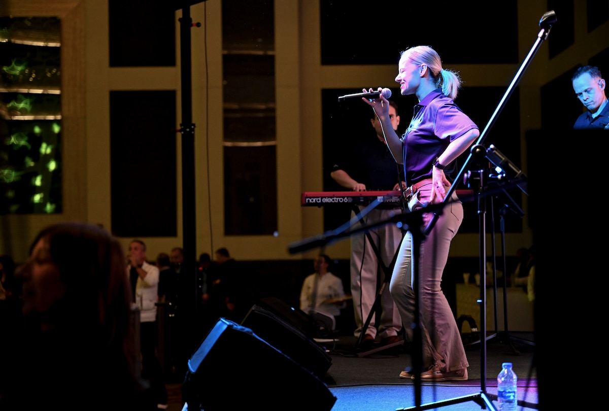U.S. Air Force Senior Airman Natalie Angst, vocalist with the U.S. Air Forces in Europe and Air Forces Africa Band’s “Touch N’ Go” ensemble, performs during a VIP reception in Adana, Türkiye, April 4, 2025. The event was part of a weeklong tour supporting the city’s annual Orange Blossom Carnaval, using music to strengthen ties between the United States and its NATO Ally. Hosted by the U.S. State Department, the reception brought together international diplomats, local officials, and community leaders. (U.S. Air Force photo by Master Sgt. Siuta Ika)