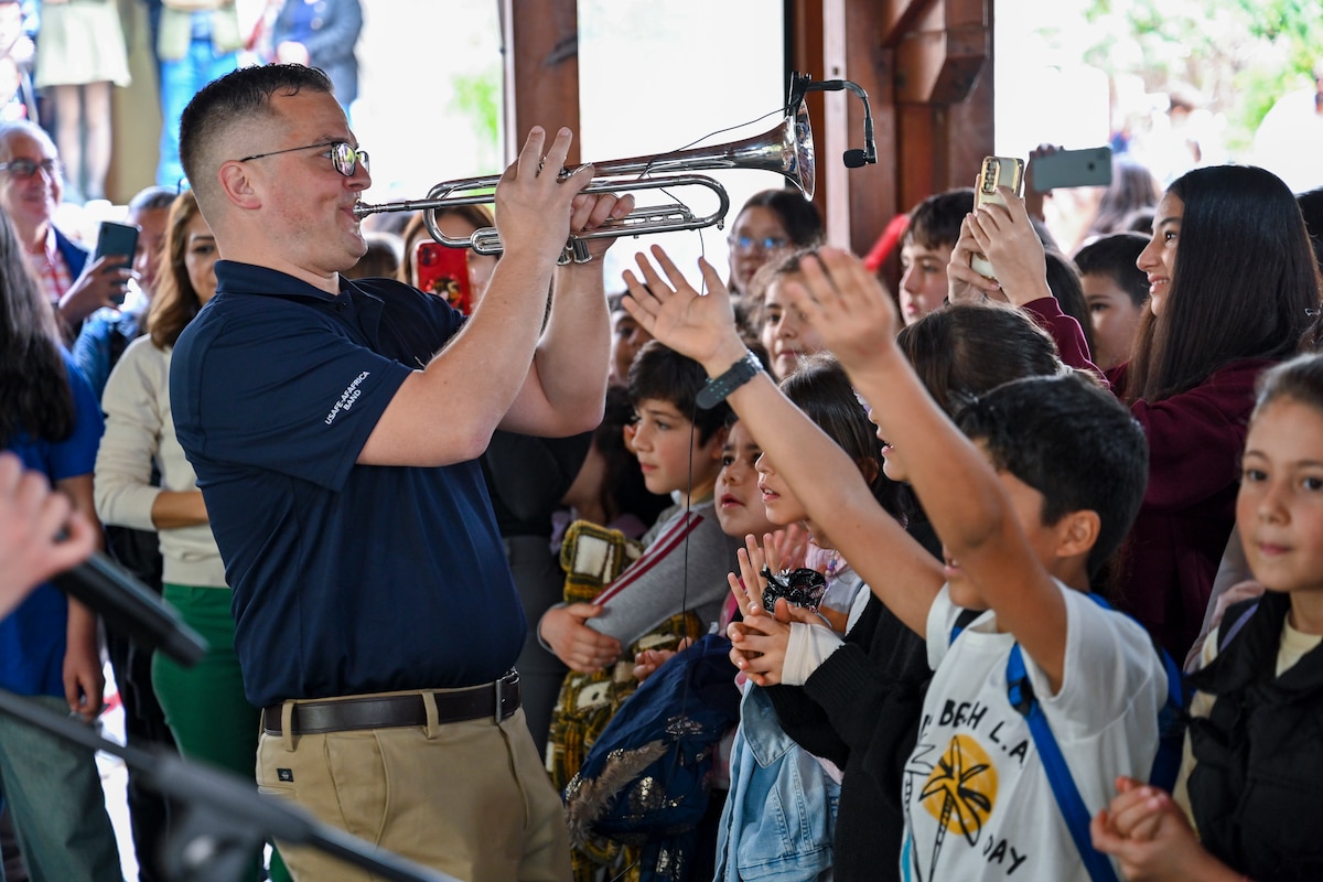 U.S. Air Force Staff Sgt. Nicholas Del Villano, trumpeter with the U.S. Air Forces in Europe and Air Forces Africa Band’s “Touch N’ Go” ensemble, performs at the Turkish American Association in Adana, Türkiye, April 6, 2025. The event brought together more than 300 students studying English and American culture, creating opportunities for meaningful cultural exchange and connection. The performance was part of a broader tour supporting the city’s annual Orange Blossom Carnaval. (U.S. Air Force photo by Master Sgt. Siuta Ika)