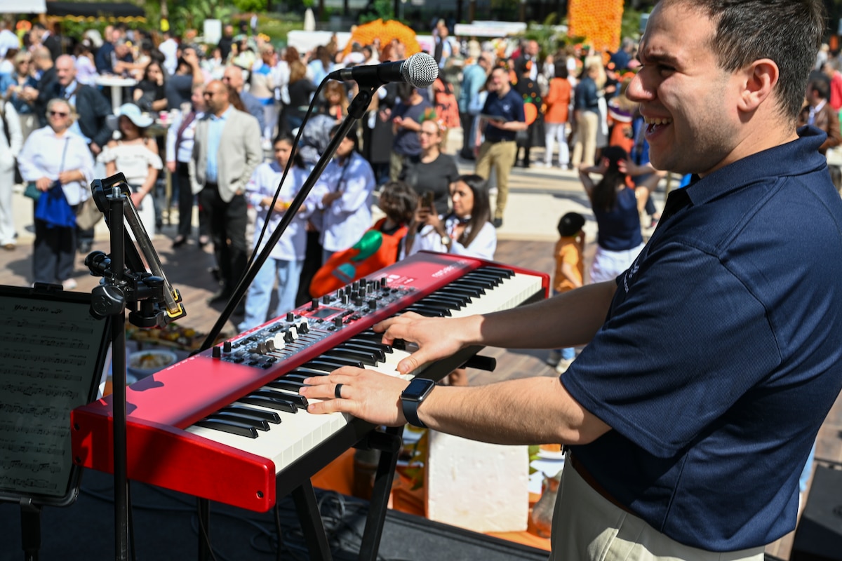 U.S. Air Force Staff Sgt. Luis Muñiz, pianist with the U.S. Air Forces in Europe and Air Forces Africa Band’s “Touch N’ Go” ensemble, performs during the Orange Flavors Show in Adana, Türkiye, April 5, 2025. The performance was part of a weeklong tour in support of the city’s annual Orange Blossom Carnaval, fostering cultural connections between the United States and its NATO Ally. The high-energy show blended American pop and rock with local flavor, drawing an enthusiastic crowd from across the community. (U.S. Air Force photo by Master Sgt. Siuta Ika)