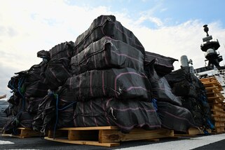 Bales of illegal narcotics are offloaded by crewmembers of Coast Guard Cutter James in Port Everglades, April 9, 2025. James’ crew offloaded more than 44,550 pounds of cocaine and 3,880 pounds of marijuana valued at approximately $509.9 million intercepted in the international waters of the Eastern Pacific Ocean. (Coast Guard photo by Petty Officer 3rd Class Jessica Walker)
