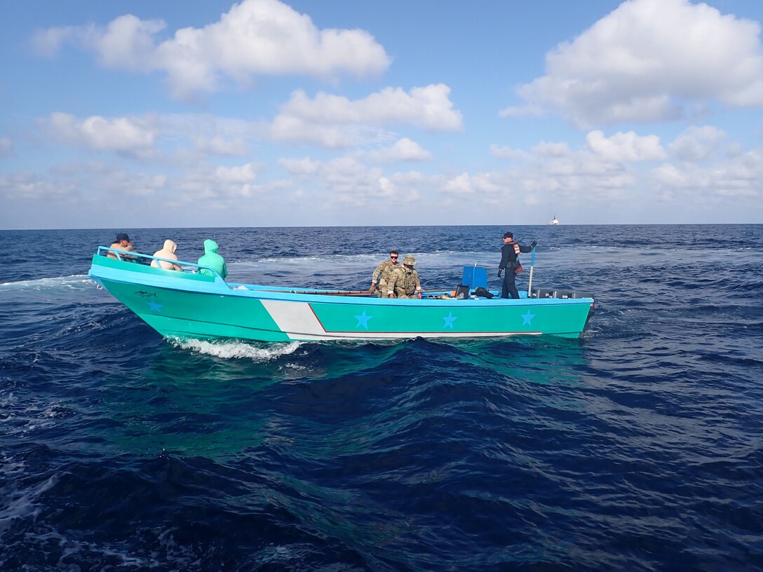 Coast Guard Cutter James law enforcement officer speak with suspected smugglers in the Eastern Pacific Ocean, Jan. 30, 2025. The crew of U.S. Coast Guard Cutter James offloaded more than 44,550 pounds of cocaine and 3,880 pounds of marijuana valued at approximately $509.9 million in Port Everglades, April 9, 2025. (U.S. Coast Guard photo)