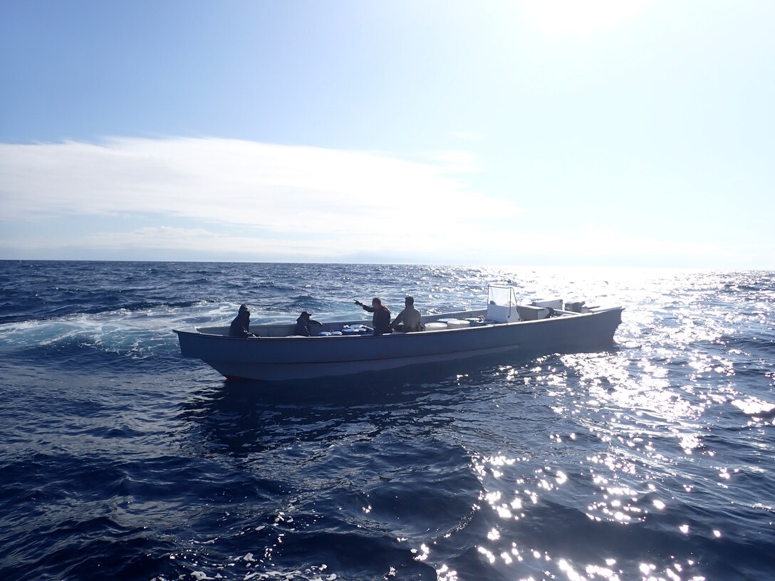 Coast Guard Cutter James law enforcement officers speak to suspected drug smugglers in the Eastern Pacific Ocean, Jan. 18, 2025. The crew of U.S. Coast Guard Cutter James offloaded more than 44,550 pounds of cocaine and 3,880 pounds of marijuana valued at approximately $509.9 million in Port Everglades, April 9, 2025. (U.S. Coast Guard photo)