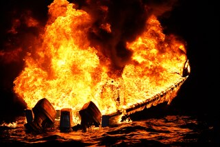 A suspected drug vessel burns in the Eastern Pacific Ocean, Feb. 1, 2025. The crew of U.S. Coast Guard Cutter James offloaded more than 44,550 pounds of cocaine and 3,880 pounds of marijuana valued at approximately $509.9 million in Port Everglades, April 9, 2025. (U.S. Coast Guard photo)