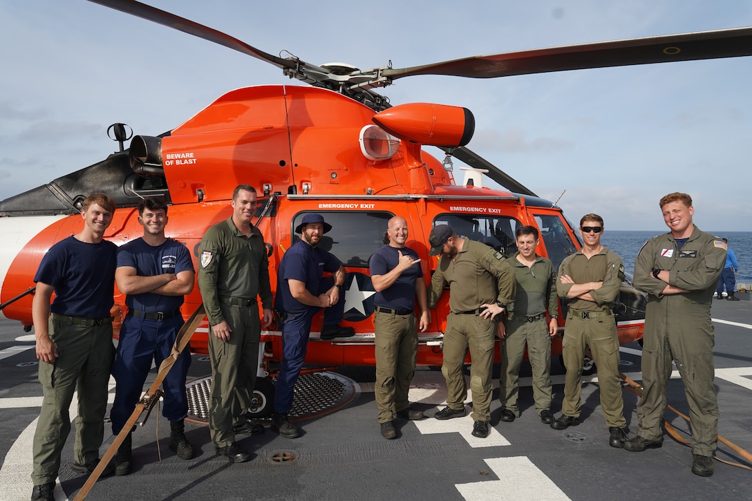 The embarked Coast Guard Helicopter Interdiction Tactical Squadron aircrew poses for a photo on the flight deck of cutter James, Jan. 11, 2025. The crew of U.S. Coast Guard Cutter James offloaded more than 44,550 pounds of cocaine and 3,880 pounds of marijuana valued at approximately $509.9 million in Port Everglades, April 9, 2025. (U.S. Coast Guard photo)