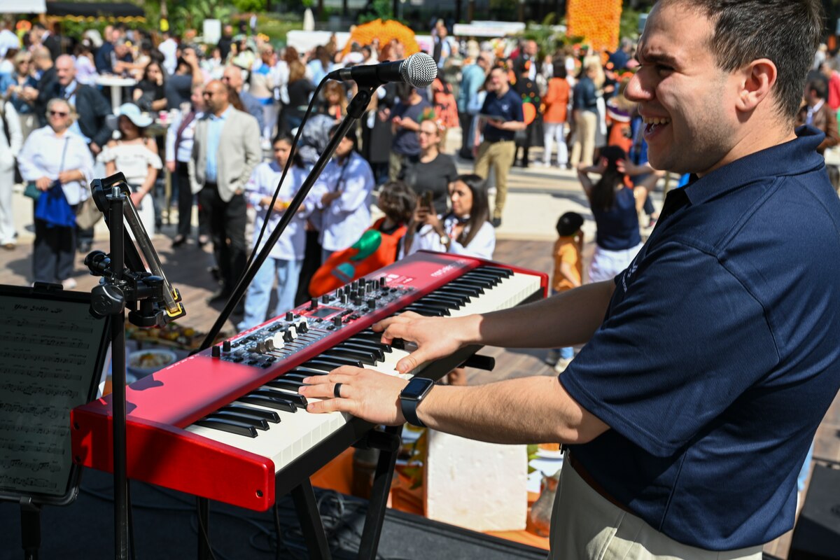 U.S. Air Force Staff Sgt. Luis Muñiz, pianist with the U.S. Air Forces in Europe and Air Forces Africa Band’s “Touch N’ Go” ensemble, performs during the Orange Flavors Show in Adana, Türkiye, April 5, 2025. The performance was part of a weeklong tour in support of the city’s annual Orange Blossom Carnaval, fostering cultural connections between the United States and its NATO Ally. The high-energy show blended American pop and rock with local flavor, drawing an enthusiastic crowd from across the community. (U.S. Air Force photo by Master Sgt. Siuta Ika)