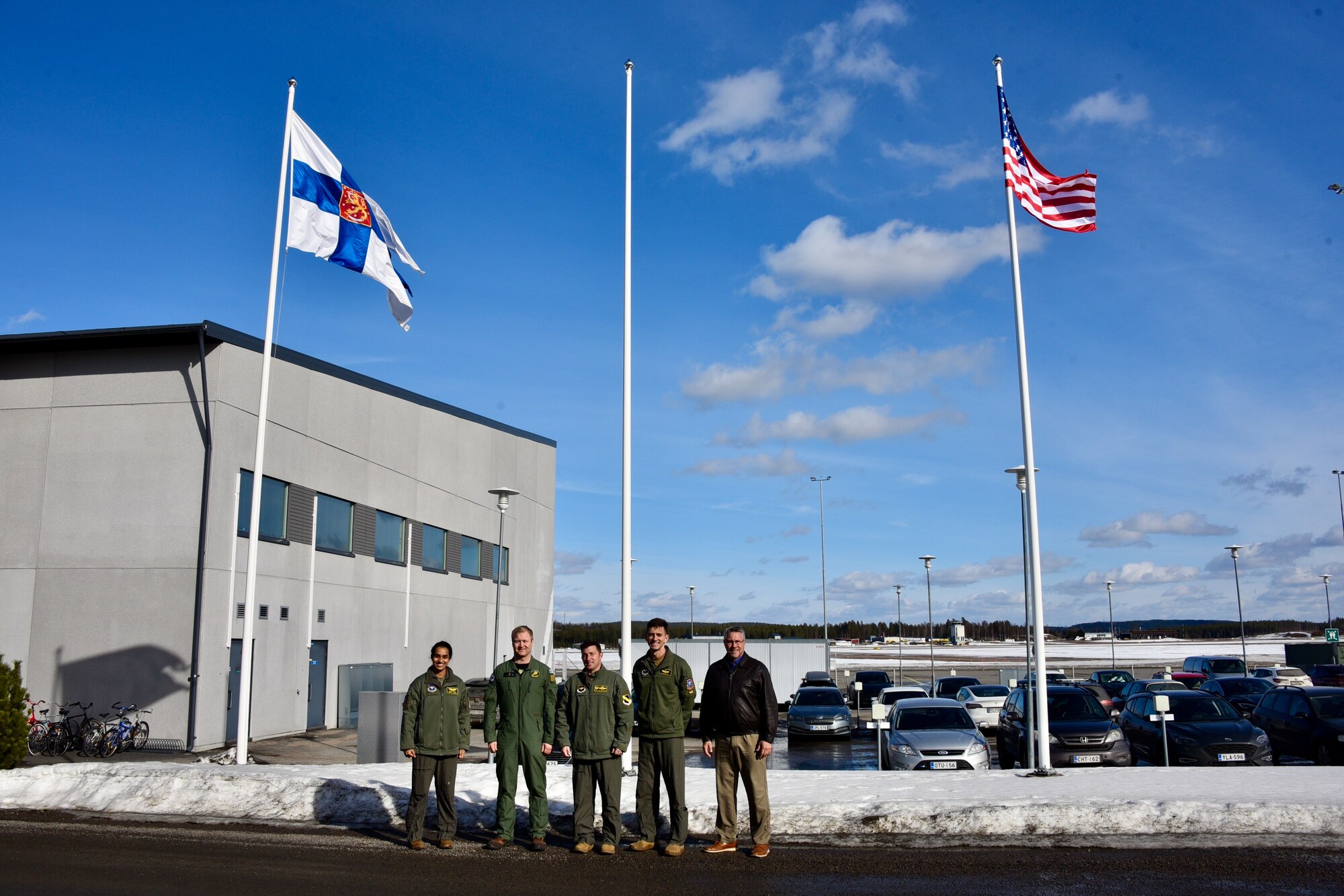 U.S. Air Force Col. Jeffrey Shulman, 80th Flying Training Wing commander, and Finnish Air Force Lt. Col. Pekka Jyrkönen, Air Force Academy, fighter squadron commander, alongside members of the 80th Flying Training Wing pose for a photo