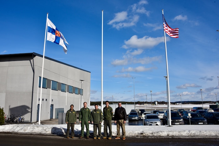 U.S. Air Force Col. Jeffrey Shulman, 80th Flying Training Wing commander, and Finnish Air Force Lt. Col. Pekka Jyrkönen, Air Force Academy, fighter squadron commander, alongside members of the 80th Flying Training Wing pose for a photo
