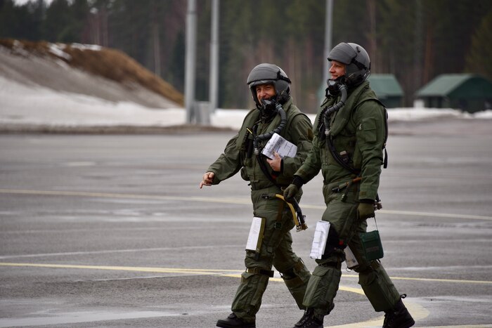 U.S. Air Force Col. Jeffrey Shulman, 80th Flying Training Wing commander, and a Finnish Air Force Academy instructor pilot, step to fly a local training sortie