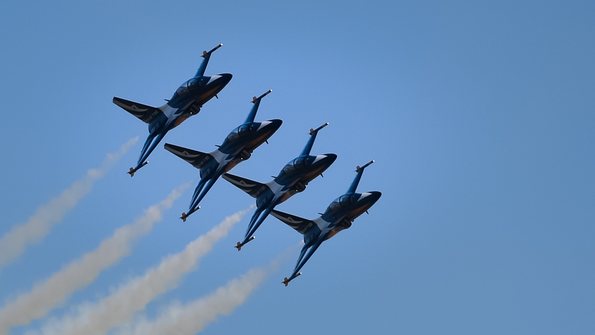 Air planes fly in formation.