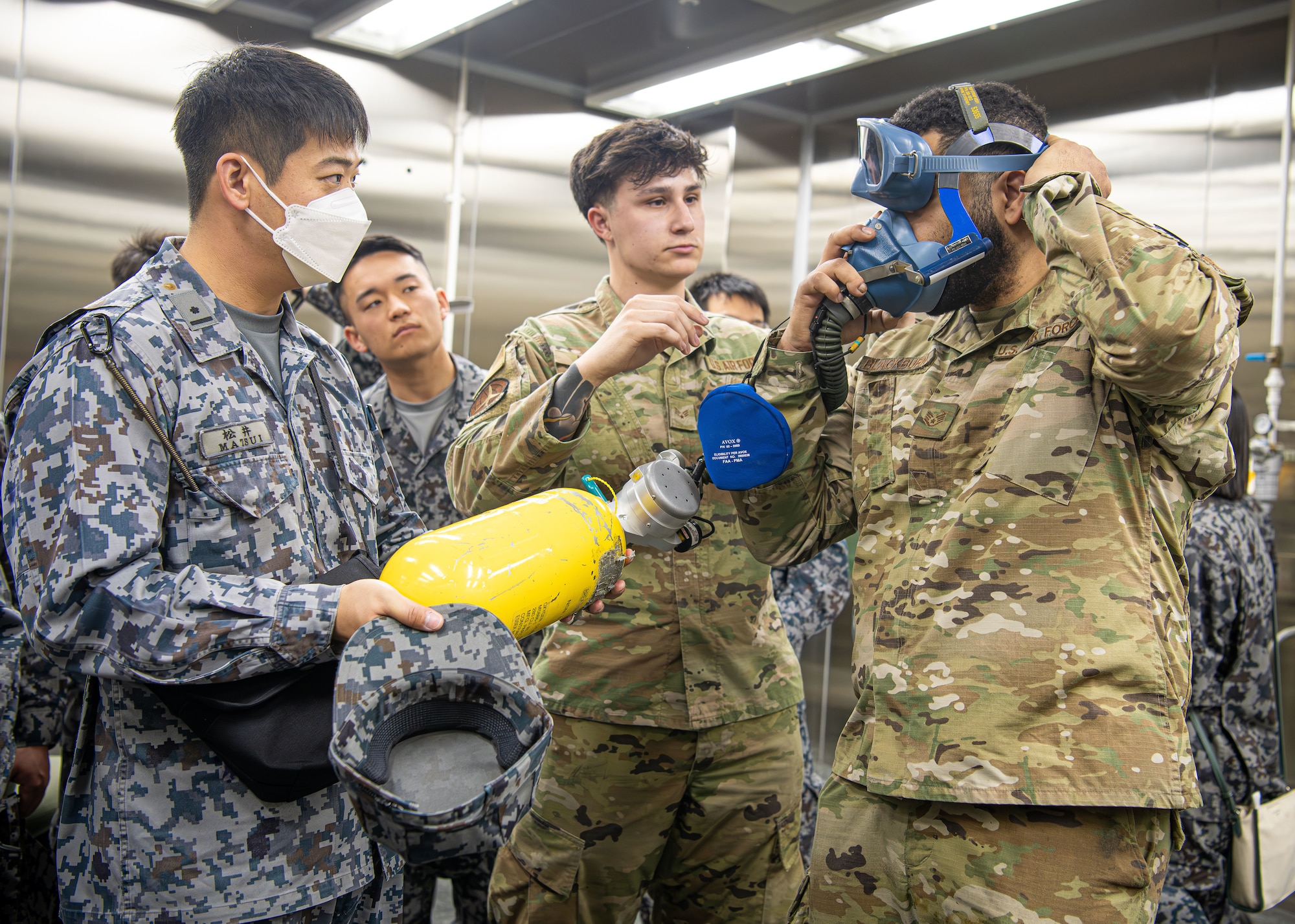 Servicemembers dawn oxygen mask.