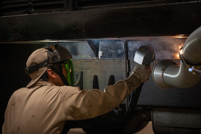 Masato Hasegawa, 35th Logistics Readiness Squadron automobile repairman, maintains government vehicles with an NPL-500 Pulse Machine.