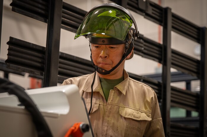 Masato Hasegawa, 35th Logistics Readiness Squadron automobile repairman, conducts a vehicle inspection.