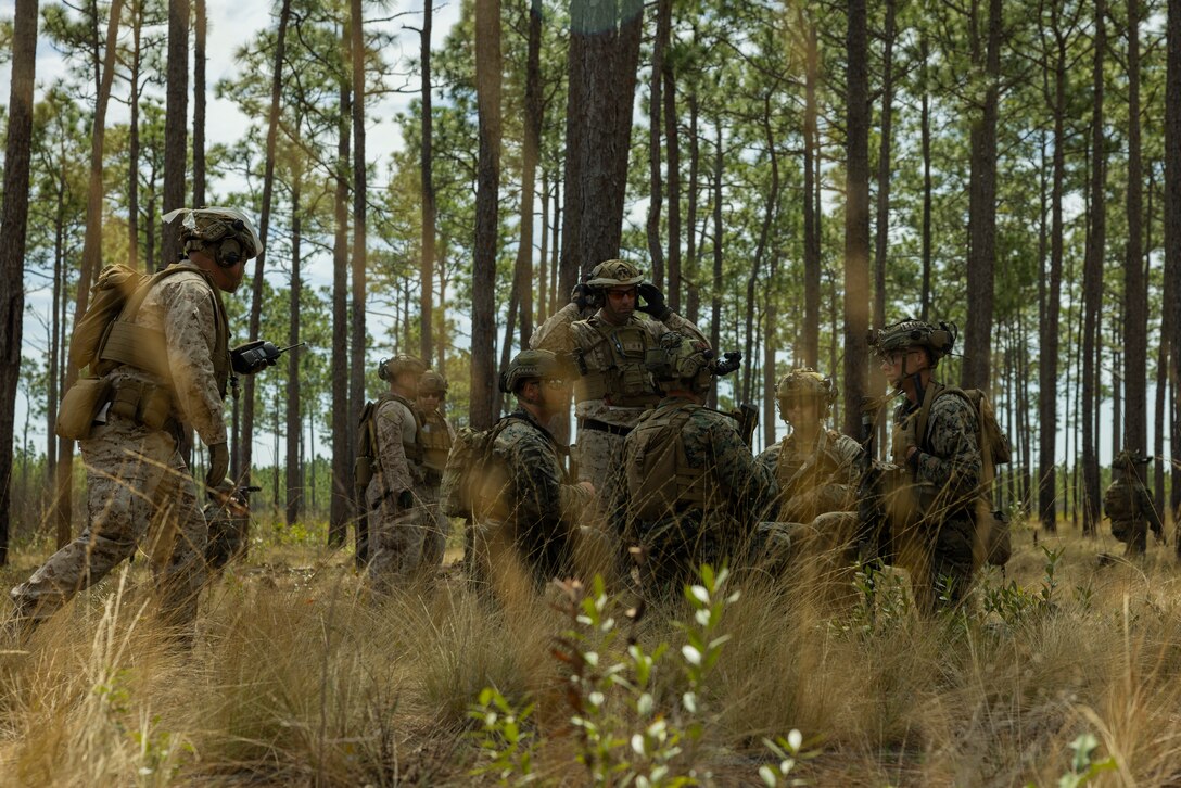 U.S. Marines with 3d Battalion, 2d Marine Regiment, 2d Marine Division, prepare to conduct a squad attack while being evaluated during the 2d MARDIV Super Squad Competition on Marine Corps Base Camp Lejeune, North Carolina, March. 20, 2025.  The 2d MARDIV Super Squad Competition evaluates the tactical proficiency of infantry rifle squads and determines, under simulated combat conditions, the Division’s most proficient and capable squad. (U.S. Marine Corps photo by Lance Cpl. Alexandria Serrano)
