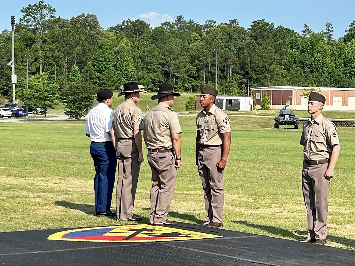 Spc. Uriel Rosario, a cavalry scout assigned to "Crazy" Troop, 1st Squadron, 94th Cavalry Regiment, is presented with the Excellence in Armor award during his one-station unit training graduation at Fort Moore, GA, June 2024.