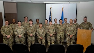 Intelligence Airmen pose for a photo during the first 54th Operations Support Squadron F-16 Fighting Falcon Intelligence Formal Training Unit graduation at Holloman Air Force Base, New Mexico, April 3, 2025.