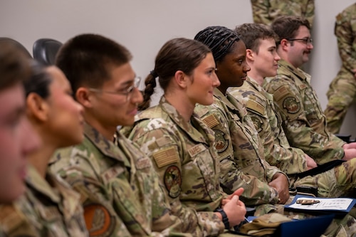 Intelligence Airmen listen to a speech during the first 54th Operations Support Squadron F-16 Fighting Falcon Intelligence Formal Training Unit graduation at Holloman Air Force Base, New Mexico, April 3, 2025.