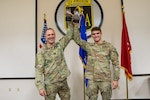 Staff Sgt. Brandon M. Byrne (left), a recruiting and retention non-commissioned officer with Alpha Company, Recruiting and Retention Battalion, and Spc. Vincent A. Bird (right), a military police officer with the 32nd Military Police Company, revel in their victory with their trophies after being named as the 2025 Wisconsin Army National Guard Best NCO and Soldier of the Year respectively during a ceremony held at Fort McCoy, Wis., March 9, 2025.