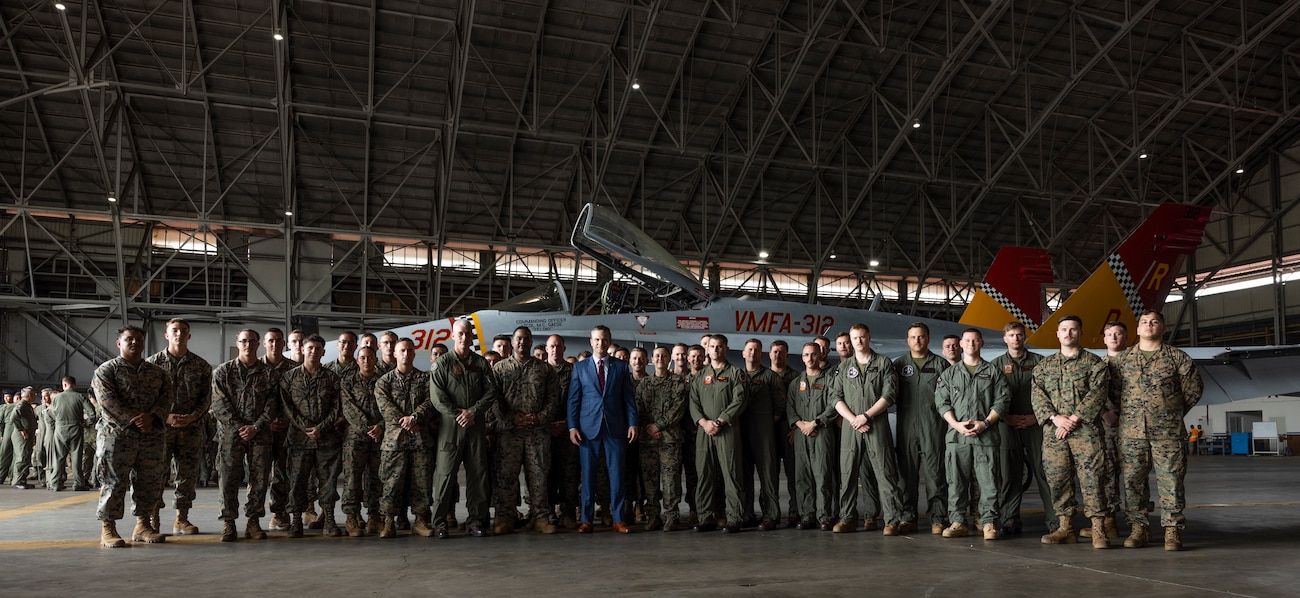 Secretary of Defense Pete Hegseth poses for a photo with U.S. Marines with Marine Fighter Attack Squadron (VMFA) 312, at Panama Pacifico Airfield, Panama, April 9, 2025. VMFA-312 continues day to day operations in support of an expanded strategic security partnership with Panama for the next week. (U.S. Marine Corps photo by Lance Cpl. Mya Seymour)
