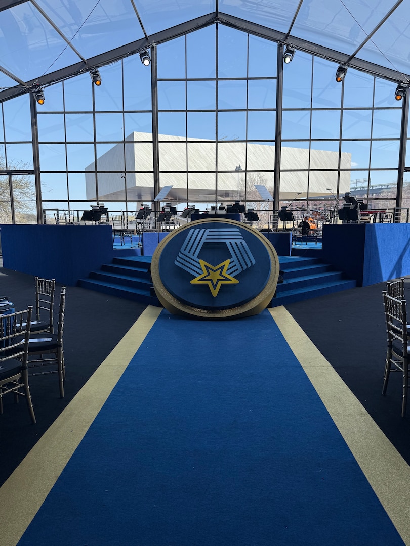Photo of blue carpet and setup for the band