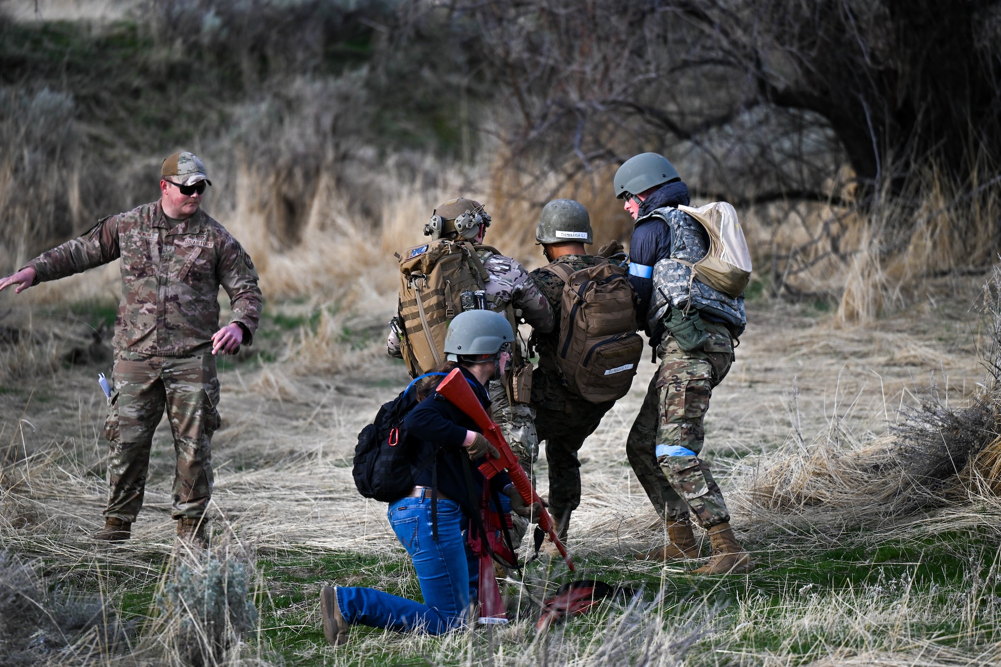 Cadets carry a simulated wounded midshipman during a training exercise