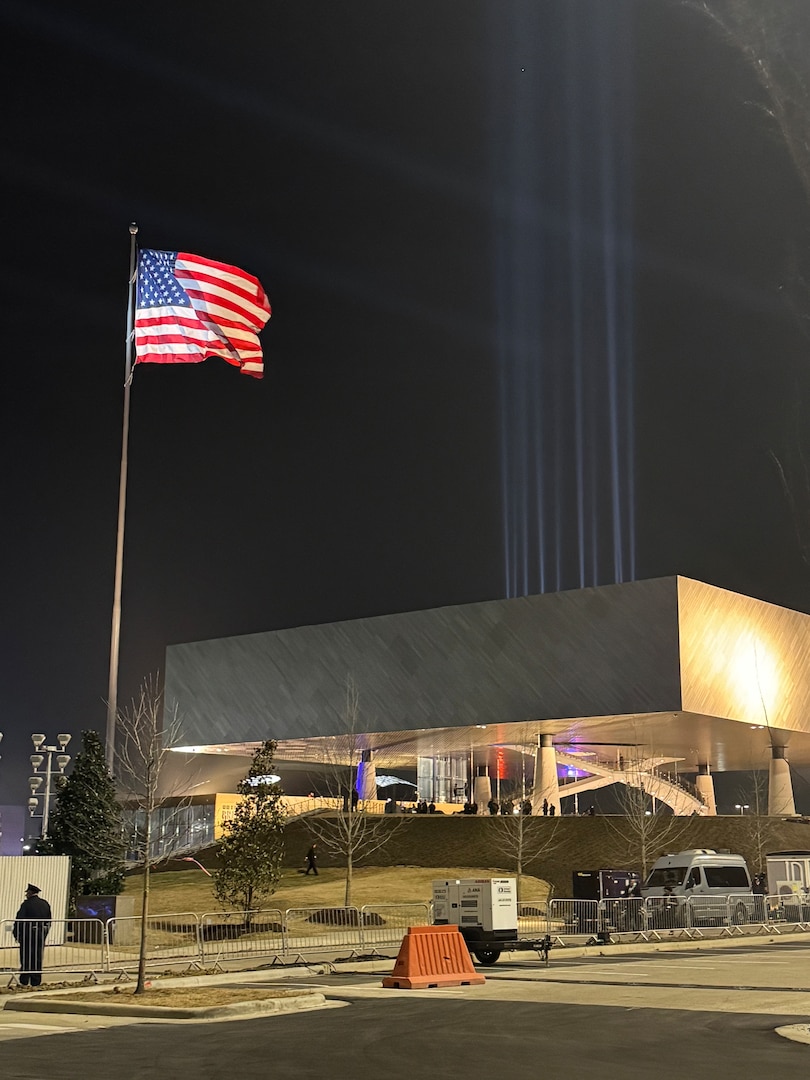 Picture of the outside of a museum with the American flag