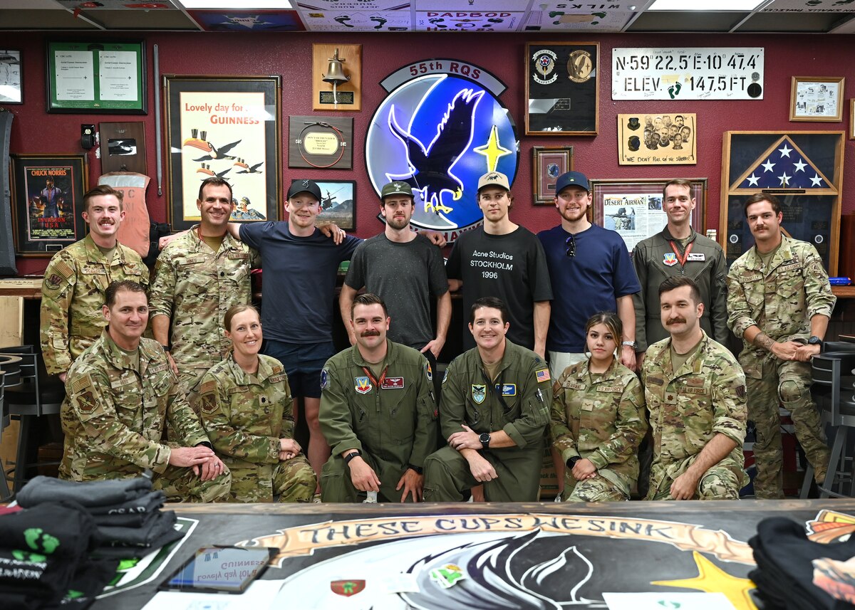 U.S. Airmen assigned to the 563rd Rescue Group pose with members of Tucson Roadrunners, a local minor league hockey team, at Davis-Monthan Air Force Base, Arizona, April 8, 2025. The 355th Wing provided a base tour to establish and maintain positive relationships with the community. (U.S. Air Force photo by Staff Sgt. Abbey Rieves)