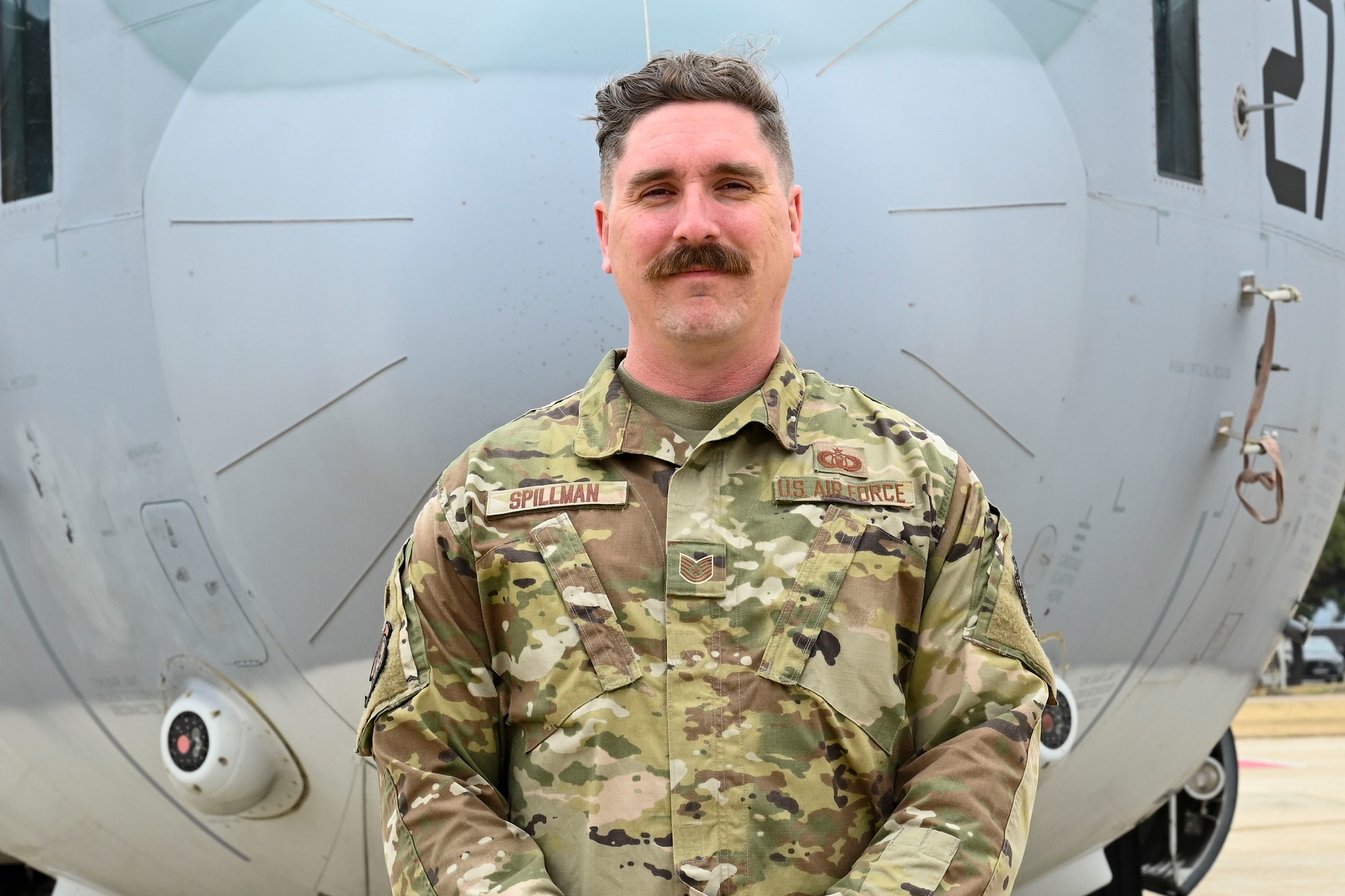 U.S. Air Force Tech. Sgt. Jacob Spillman, 8th Operational Support Squadron air traffic control standards and evaluations NCO in charge, poses with a Marine KC-130 Super Hercules at Kunsan Air Base, Republic of Korea.