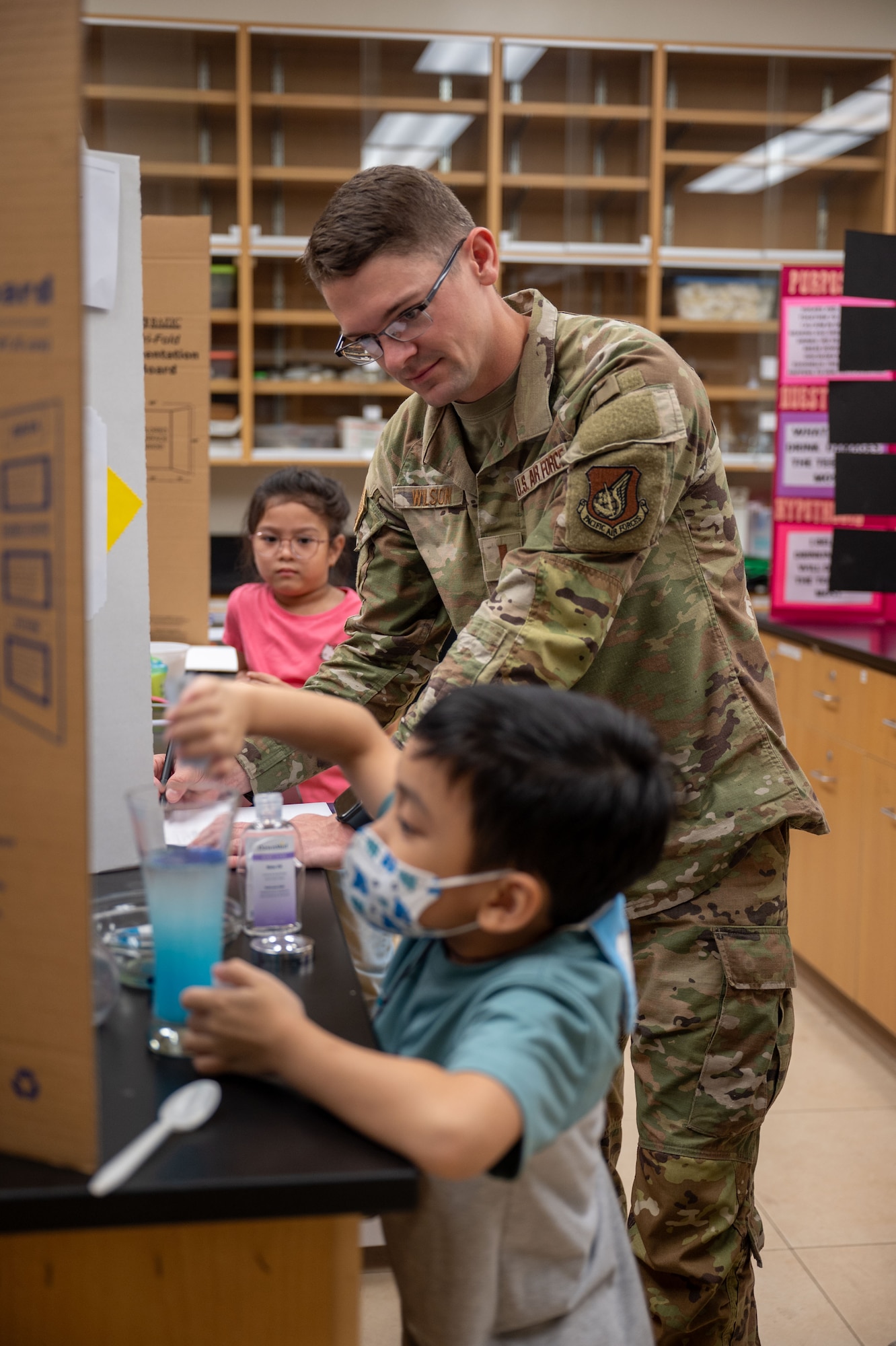 36th Medical Group, evaluate a science project during the Guam Island Wide Science Fair at the University of Guam, April 5, 2025. The purpose of the fair was to stimulate an interest in science in the Guam youth and community. (U.S. Air Force photo by Senior Airman Audree Campbell)
