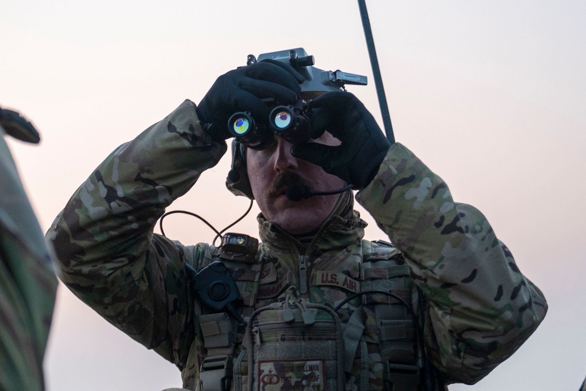 U.S. Air Force Tech. Sgt. Jacob Spillman, 8th Operational Support Squadron air traffic control standards and evaluations NCO in charge, calibrates night-vision goggles for nighttime landing zone operations at Kunsan Air Base, Republic of Korea.