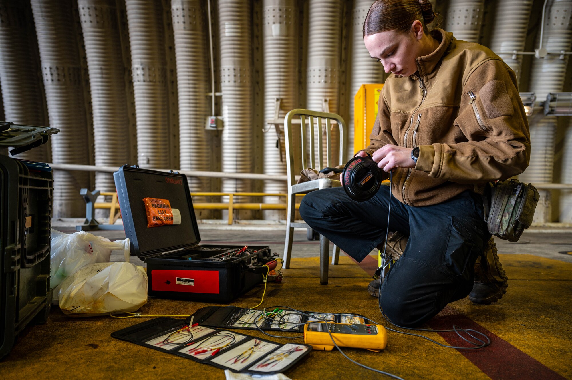 U.S. Air Force Staff Sgt. Alexandria Helms, 36th Fighter Generation Squadron F-16 Fighting Falcon avionics craftsman, performs a tool accountability check at Osan Air Base, Republic of Korea, April 9, 2025. Helms handles the repair of wiring on the aircraft, which consists of 15 miles of wiring distributed across 250 wiring harnesses. (U.S. Air Force photo by Staff Sgt. Christopher Tam)