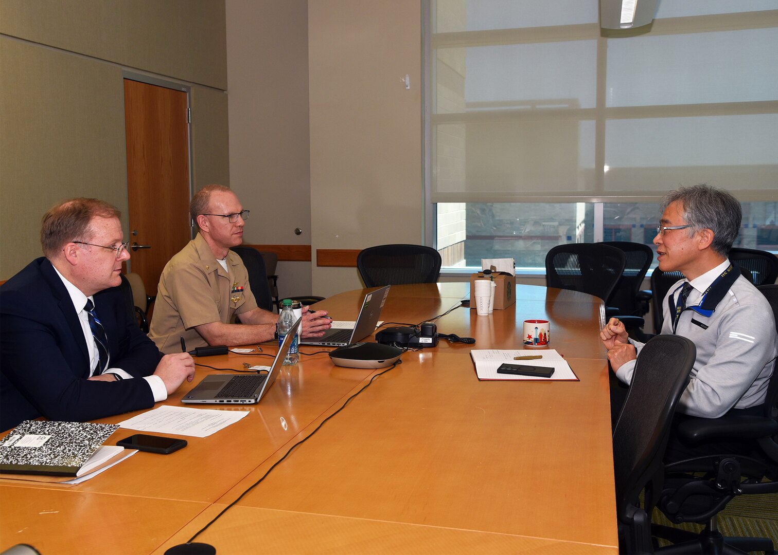 JOINT BASE SAN ANTONIO-FORT SAM HOUSTON – (April 8, 2025) – Dr. Yoon Hwang, a principal investigator assigned to Naval Medical Research Unit (NAMRU) San Antonio’s Craniofacial Health and Restorative Medicine directorate, speaks with Derek English and Lt. Cmdr. Matt Shipman, military deputy director, Department of the Navy (DON) Human Research Protection Program (HRPP) during a site visit to NAMRU San Antonio at the Battlefield Health and Trauma Research Institute. The DON HRPP is responsible for ensuring human subjects research conducted or supported by U.S. Navy complies with federal, DoD and Navy regulations. Its mission is to ensure the ethical treatment of human subjects in DON-conducted or supported research by promoting adherence to the ethical principles, laws, regulations, and policies that protect human subjects.  NAMRU San Antonio is one of eight research commands within Navy Medicine Research and Development. Its mission is to conduct gap driven combat casualty care, craniofacial, and directed energy research to improve survival, operational readiness, and safety of DoD personnel engaged in routine and expeditionary operations. (U.S. Navy photo by Burrell D. Parmer, NAMRU San Antonio Public Affairs/Released)