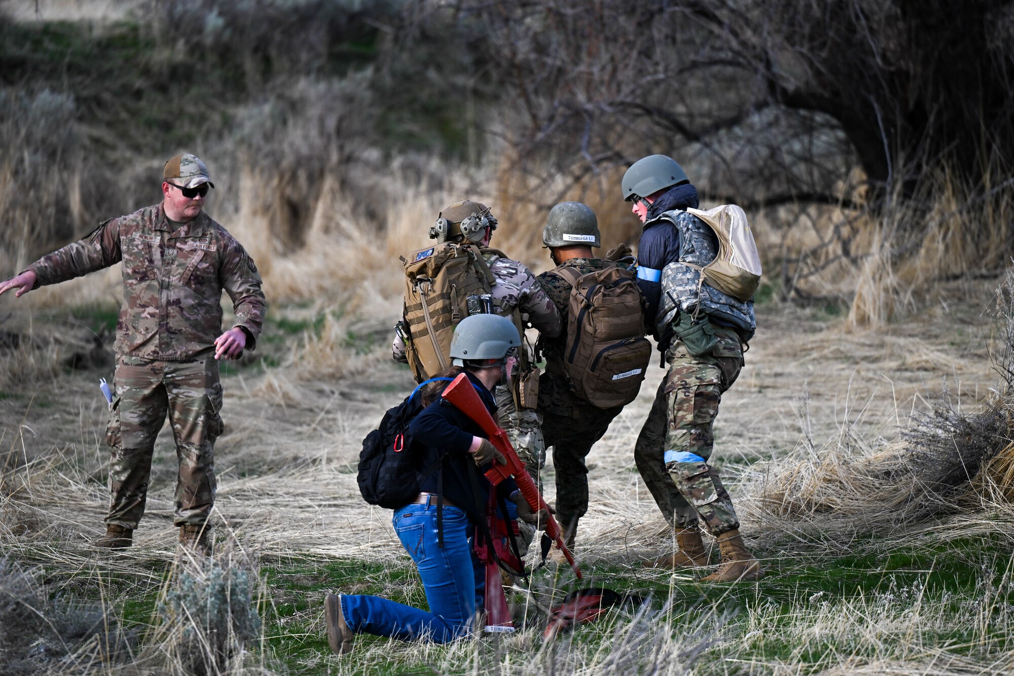 Cadets carry a simulated wounded midshipman during a training exercise