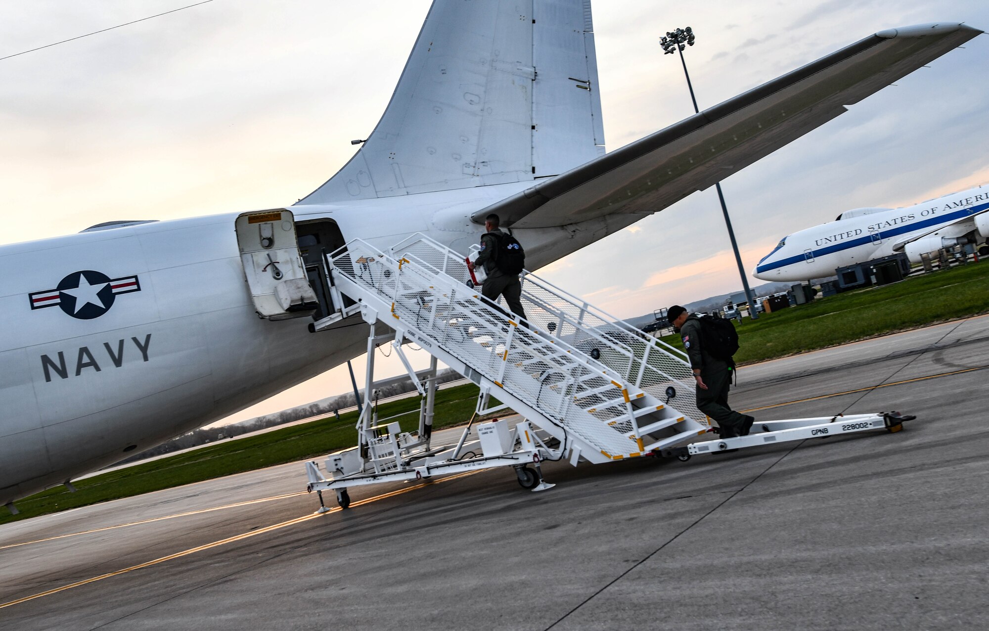 Airmen assigned to the 625th Strategic Operations Squadron board a U.S. Navy E6-B