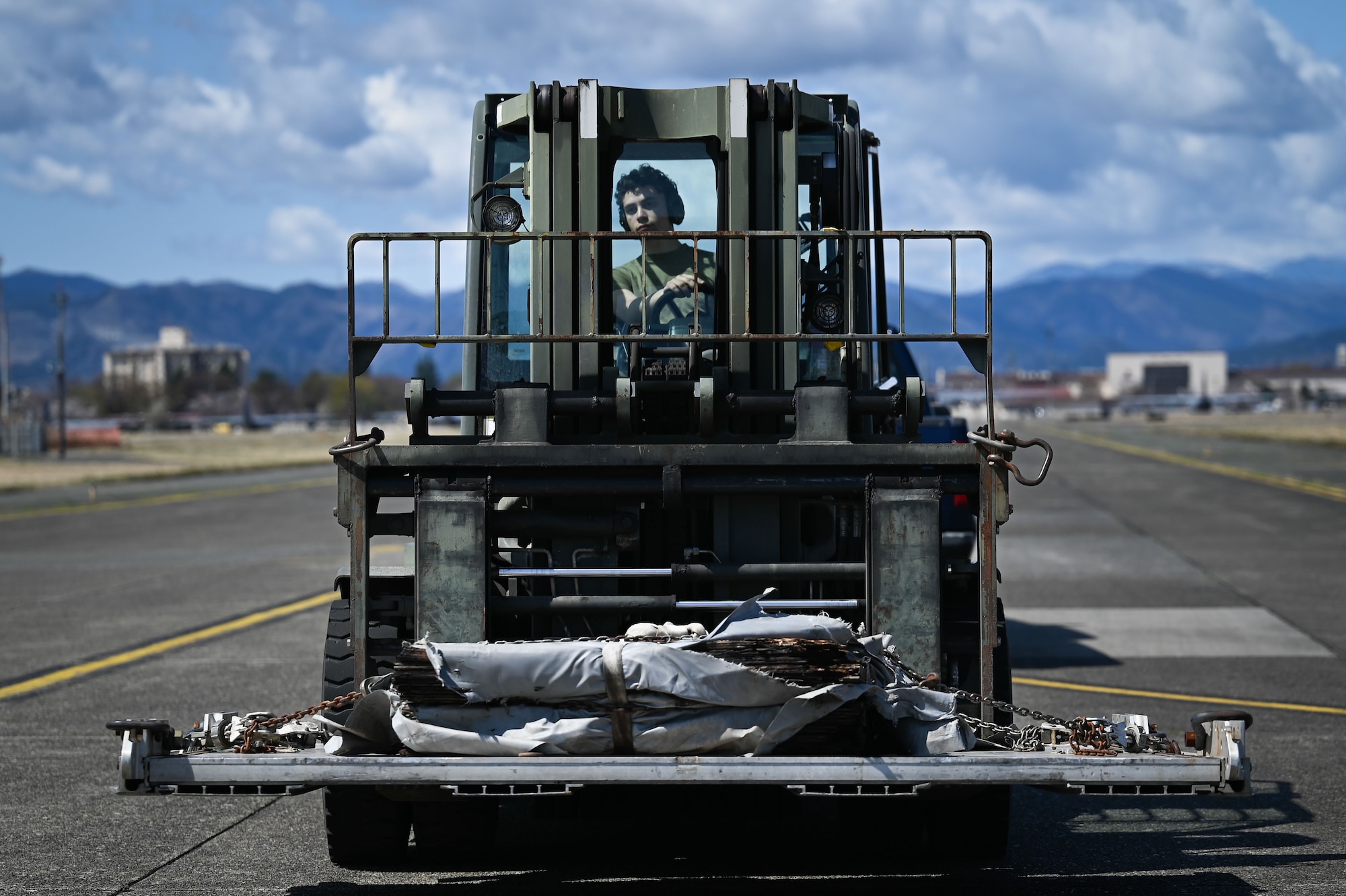 Man operates forklift