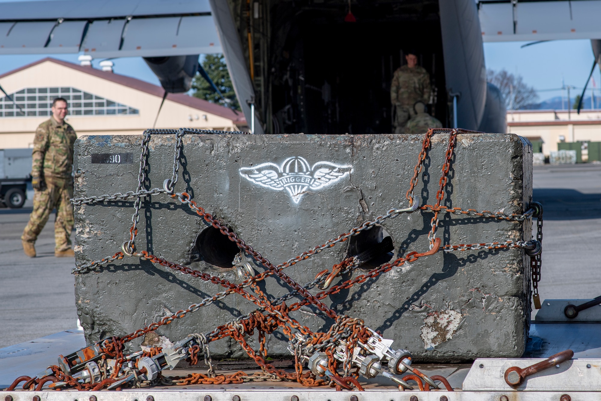 Cement block is loaded onto aircraft