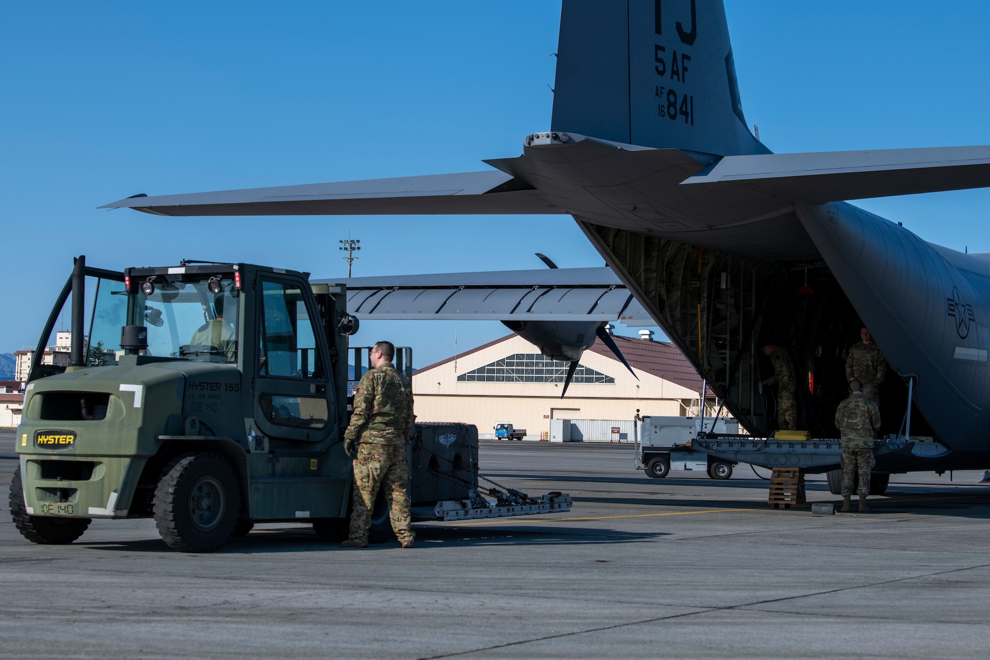 Airmen prepare for cargo load.