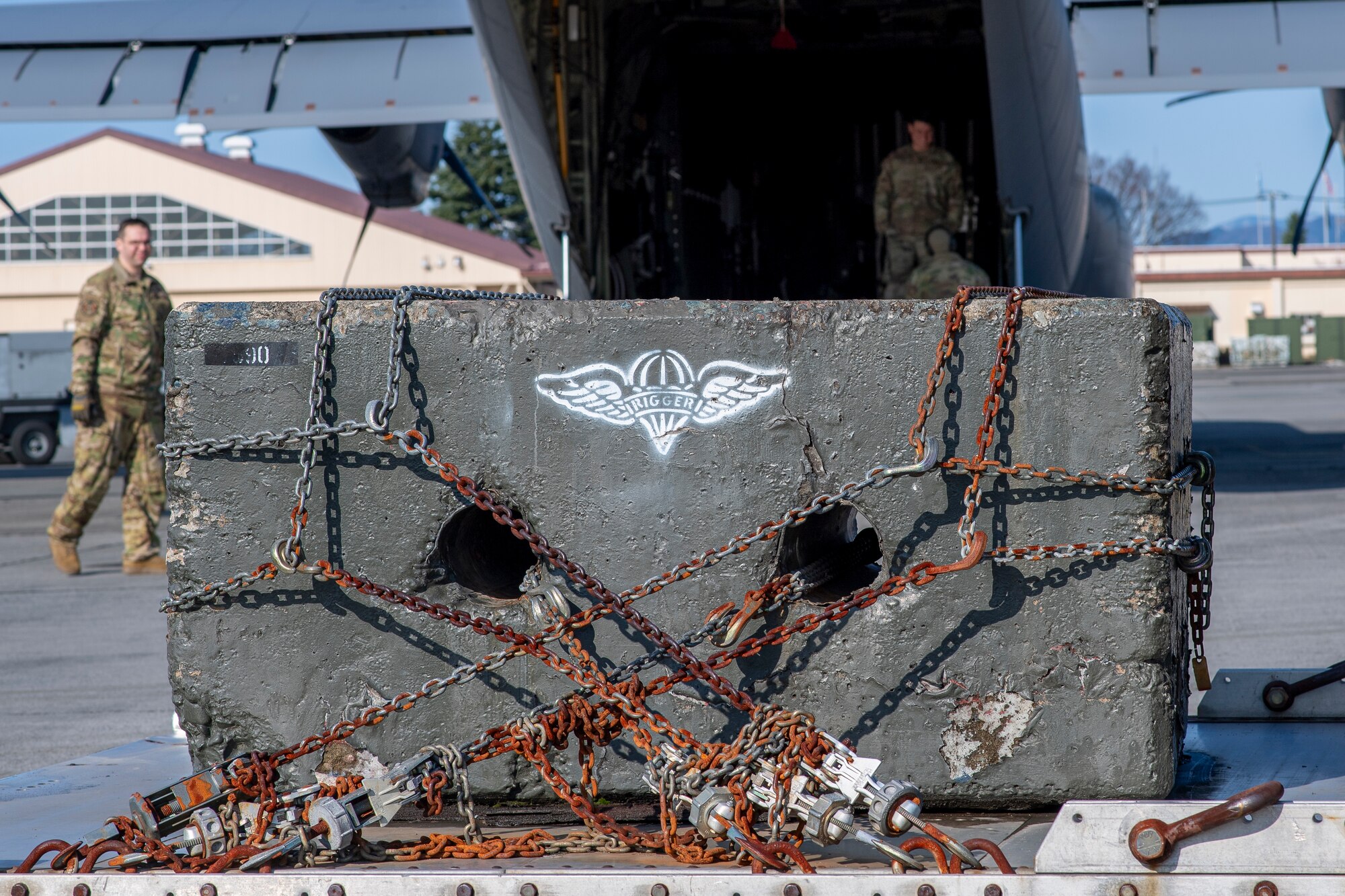 Cement block is loaded onto aircraft