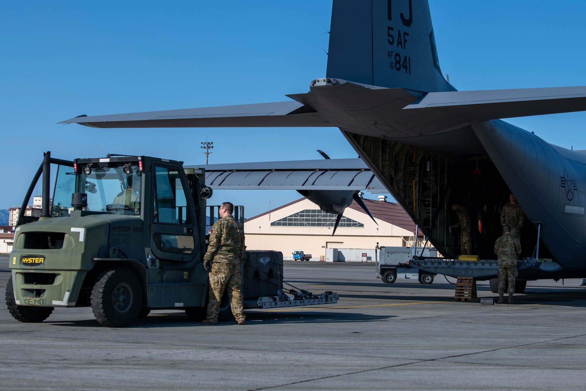 Airmen prepare for cargo load.
