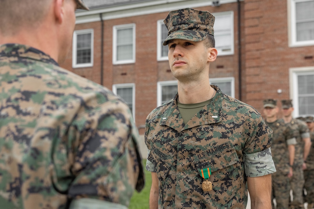 U.S. Marine Corps First Lt. Goldberg receives a Navy and Marine Corps Achievement Medal during an award ceremony on MCB Quantico, April 10, 2025. Goldberg and two other Marine officers performed life-saving actions to an unconscious woman at a bus stop in Phoenix, Feb. 7 2025. Goldberg immediately looked for an opioid antagonist after realizing her pulse was low and breathing was shallow. After applying the Narcan, the woman’s condition improved, and emergency medical services arrived. As EMS took the woman, they explained to the Marines they probably saved her life. (U.S. Marine Corps photo by Lance Cpl. Harleigh Faulk)