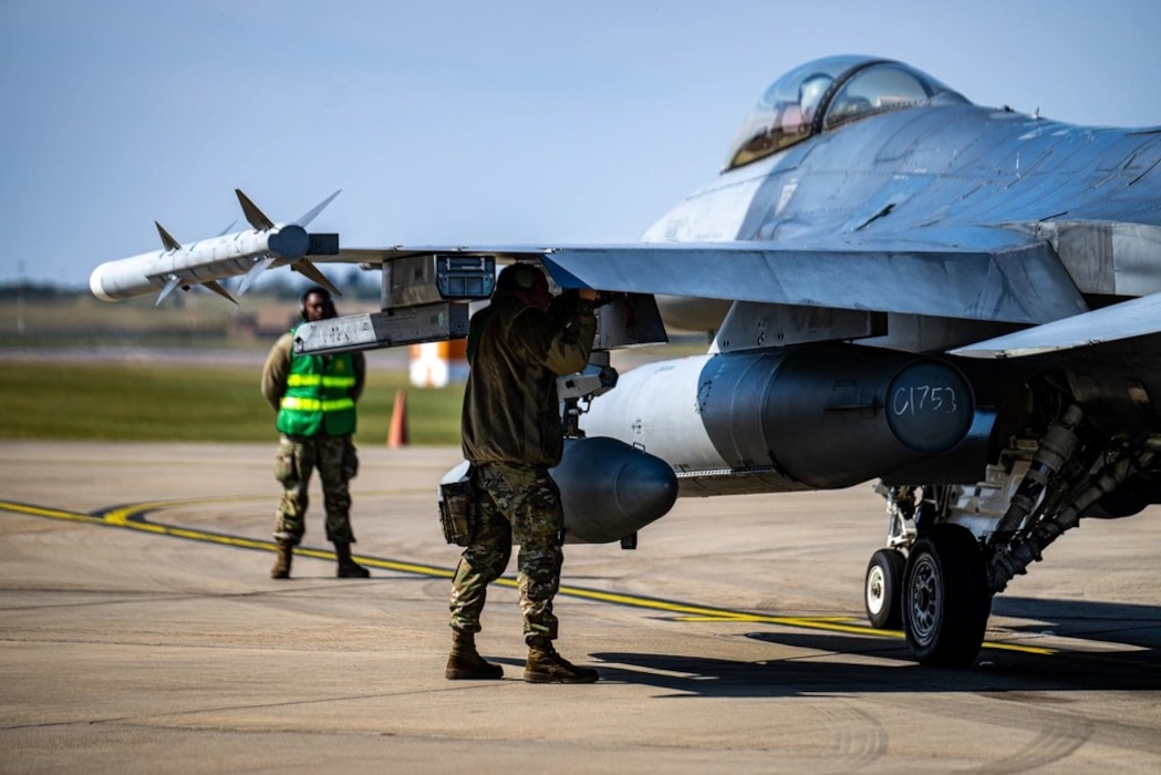 U.S. Air Force Senior Airman Logan Millman, 555th Fighter Generation Squadron weapons load crew member, disarms an F-16 Fighting Falcon from the 555th Fighter Squadron after landing for Combat Archer UK at RAF Lakenheath, England, April 8, 2025. Combat Archer UK was designed to test both the 555th FS and FGS’s skills needed for wartime operational mission readiness. (U.S. Air Force photo by Airman 1st Class Zachary Jakel)