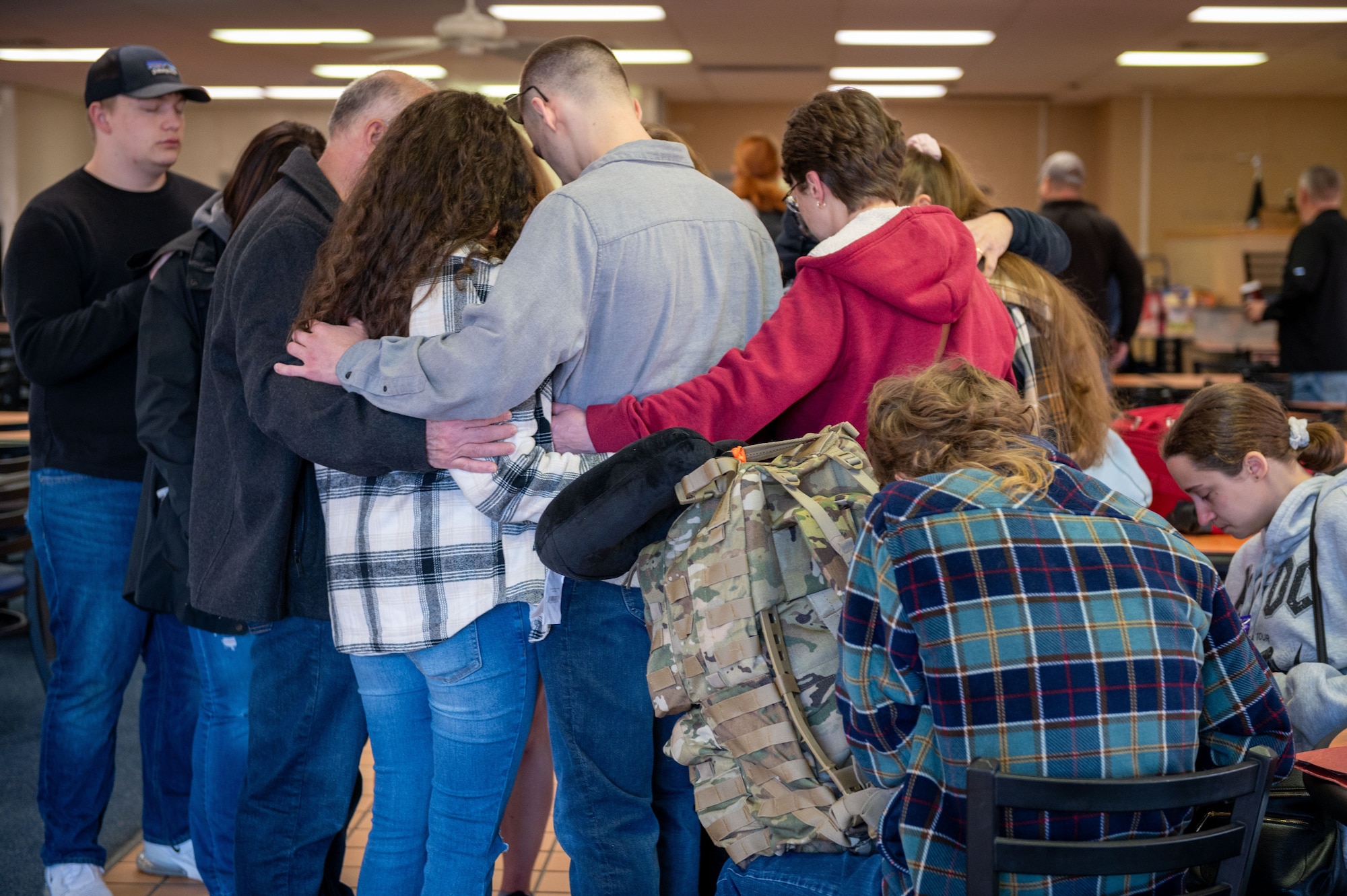a group of people huddle together