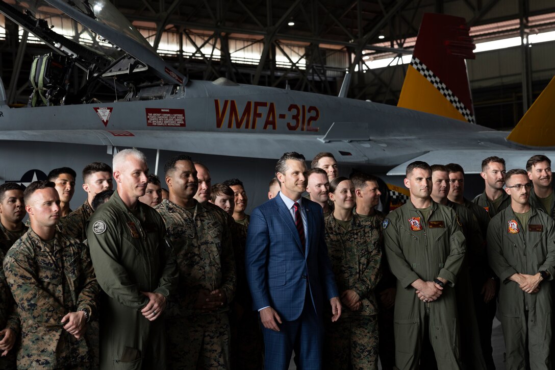Secretary of Defense Pete Hegseth poses for a photo with U.S. Marines with Marine Fighter Attack Squadron (VMFA) 312, at Panama Pacifico Airfield, Panama, April 9, 2025. VMFA-312 continues day to day operations in support of an expanded strategic security partnership with Panama for the next week. (U.S. Marine Corps photo by Lance Cpl. Mya Seymour)