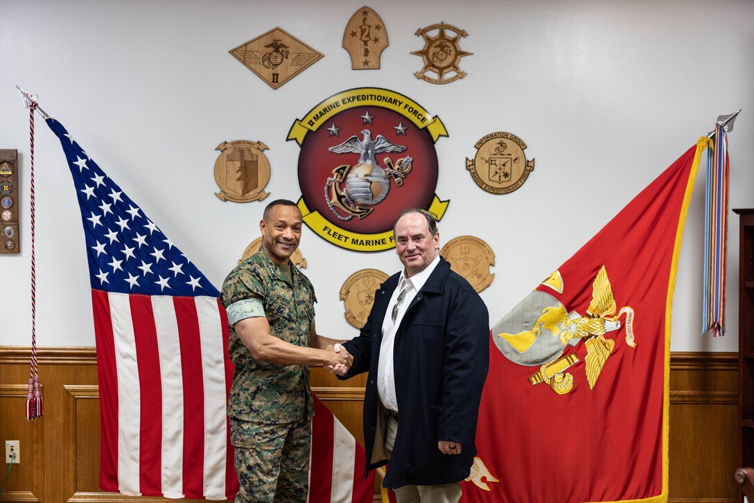 U.S. Marine Corps Lt. Gen. Calvert L. Worth, left, the commanding general of II Marine Expeditionary Force, welcomes Secretary of the Navy John Phelan at Marine Corps Base Camp Lejeune, North Carolina, April 9, 2025. During the visit, Lt. Gen. Worth and Mr. Phelan discussed crisis response capabilities while reinforcing the Department of the Navy’s commitment to maintaining a ready force capable of rapid forward deployment. (U.S. Marine Corps photo by Staff Sgt. Alexa M. Hernandez)