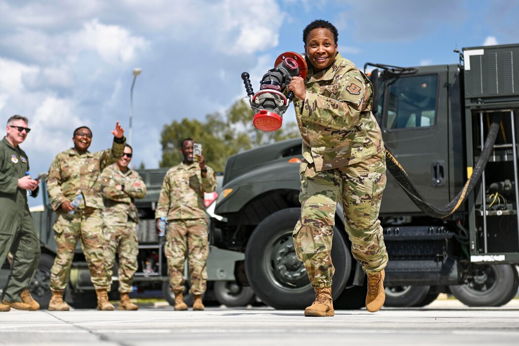 Airman pulling hose