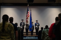 four Airmen on a stage