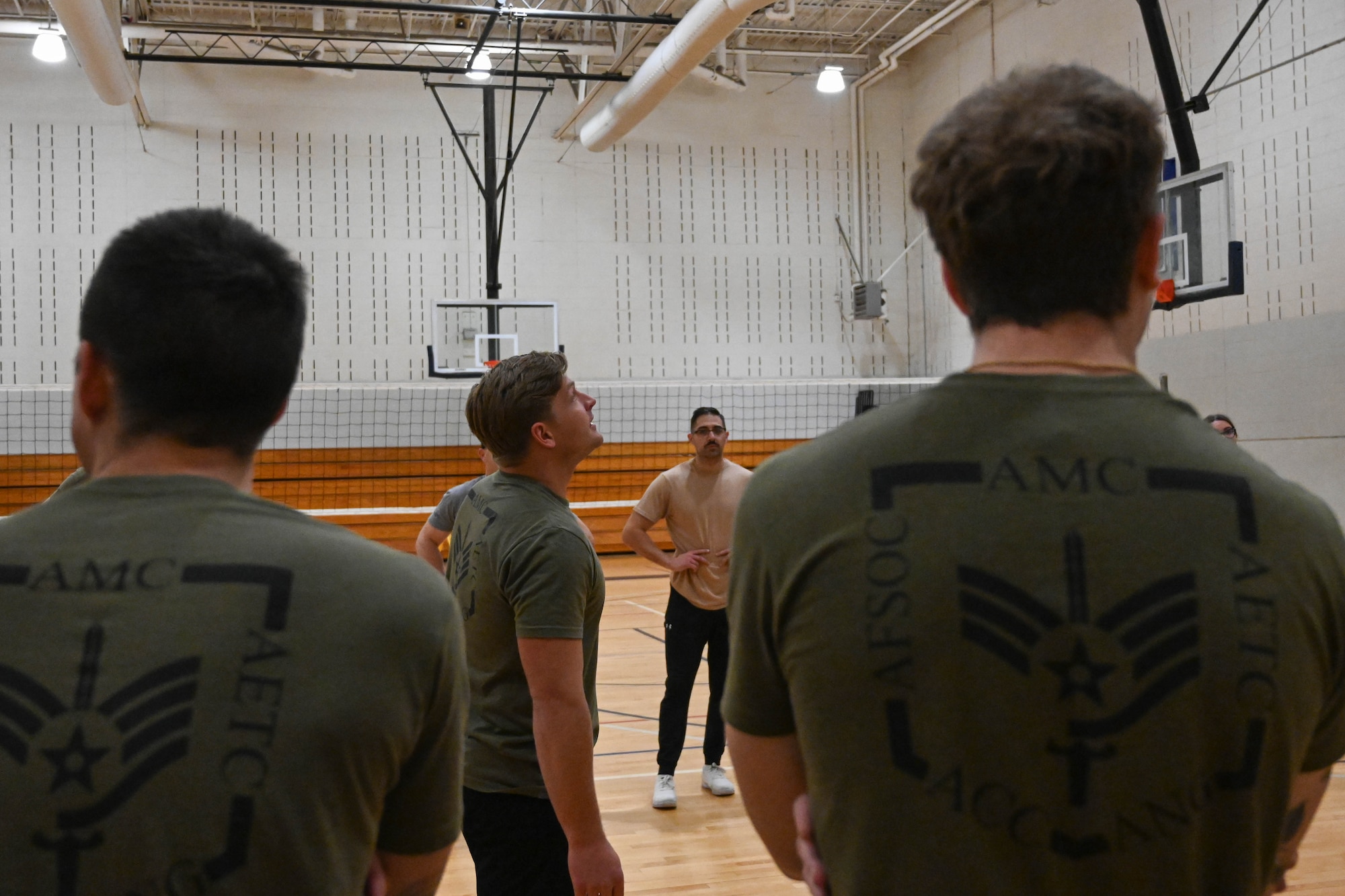 Airmen prepare to play volleyball.