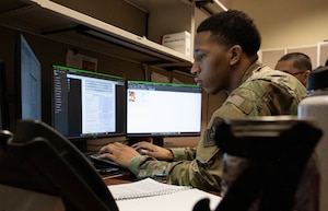 An Airman looks at a computer.