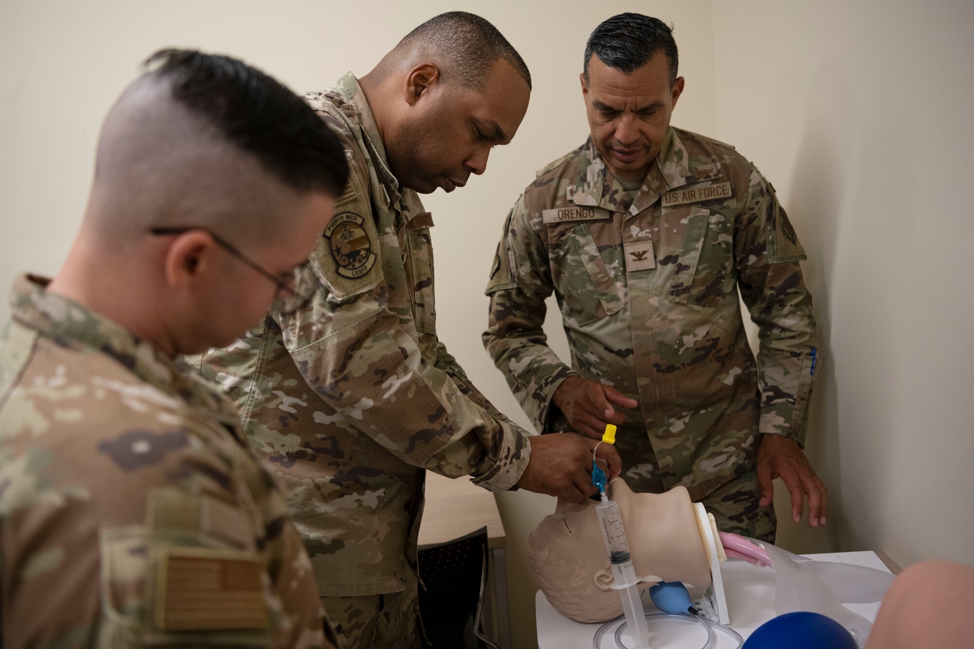 U.S. Air Force Lt. Col. Nolberto Santos, nursing officer in charge, 156th Medical Group, Detachment 1, Puerto Rico Air National Guard, showcases an endotracheal intubation training station during the medical group trauma training simulator lab inauguration at Muñiz Air National Guard Base, Carolina, Puerto Rico, April 6, 2025. The inauguration was conducted by demonstrating the lab's capabilities to 156th Wing leadership and Puerto Rico state guard air members as part of the third phase of a five-phase medical modernization project valued at approximately $160k. (U.S. Air National Guard photo by Master Sgt. Rafael D. Rosa)